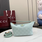 Gucci shoulder bag in light blue with GG monogram canvas, gold hardware, top zip