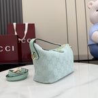 Gucci shoulder bag light blue GG monogram pattern, curved flap front, gold trim