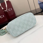 Gucci light blue GG monogram bag, side view with zip closure and smooth trim