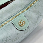 Gucci light blue GG monogram zip pouch detail with gold zipper and logo patch