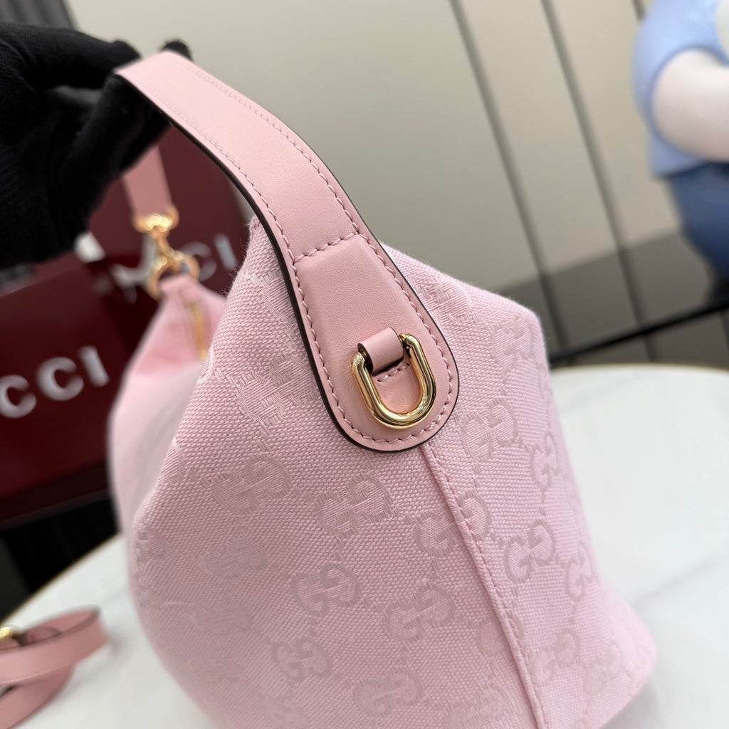 Gucci pink monogram hobo bag with leather strap and gold-tone buckle detail