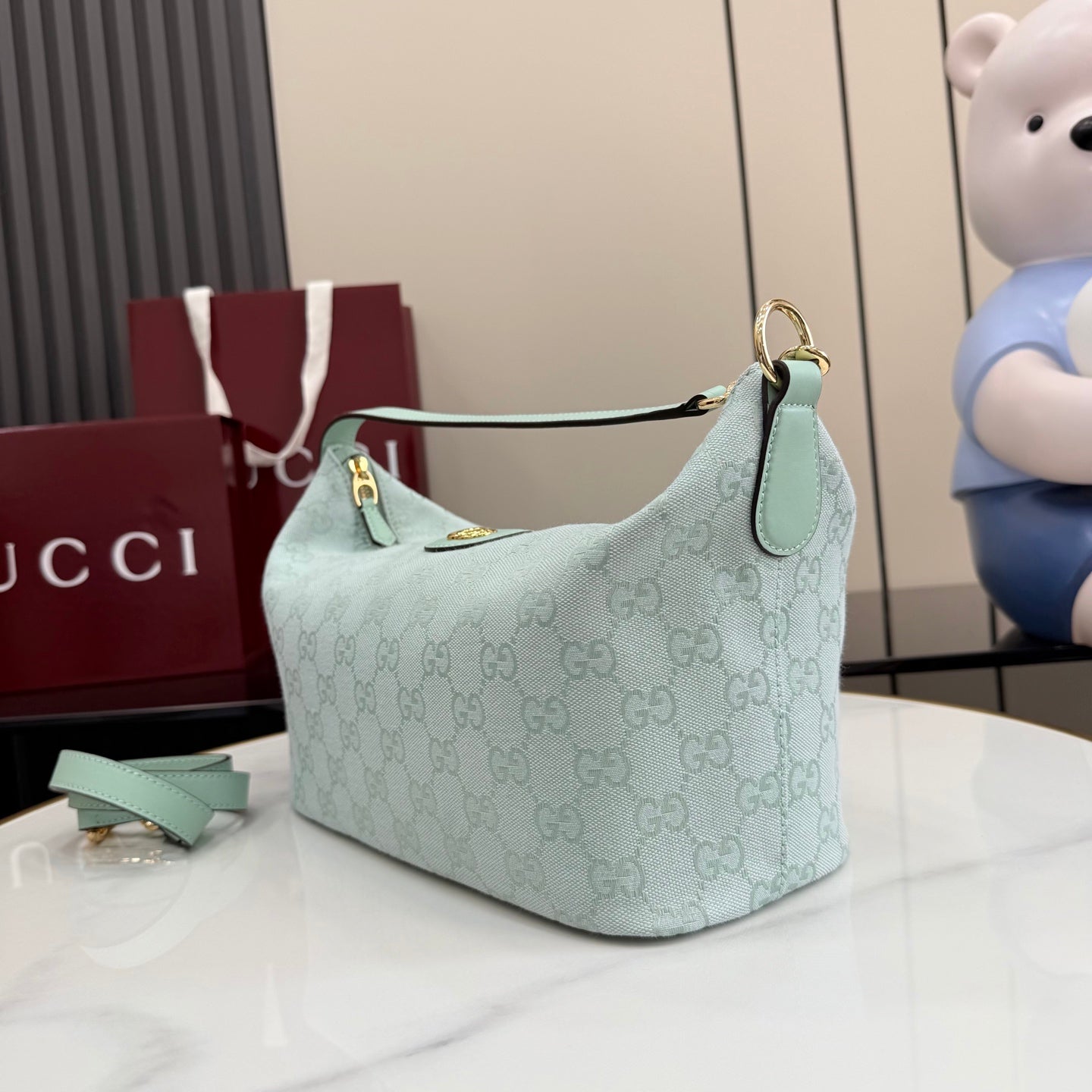 Gucci hobo bag light blue GG monogram with top handle strap and gold ring hardware