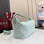 Gucci hobo bag light blue with GG monogram, curved top handle strap, and gold accents