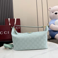 Gucci hobo bag in light blue with GG monogram canvas and gold top handle hardware
