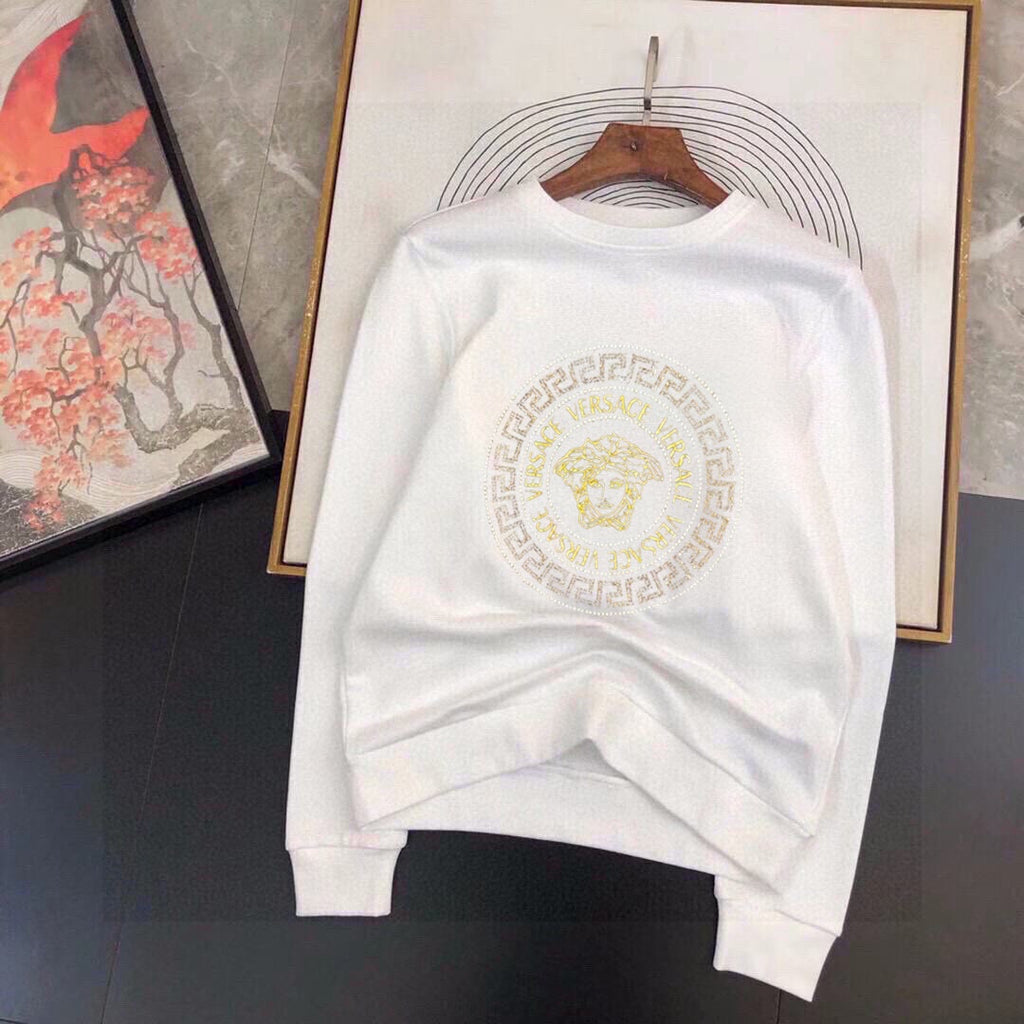 White sweatshirt with gold Medusa emblem print and ribbed crewneck cuffs