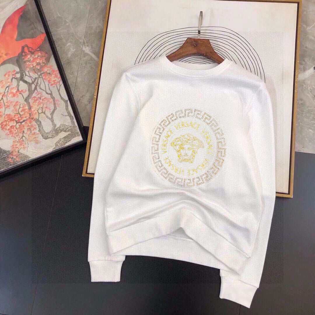 White sweatshirt with gold Medusa emblem print and ribbed crewneck cuffs