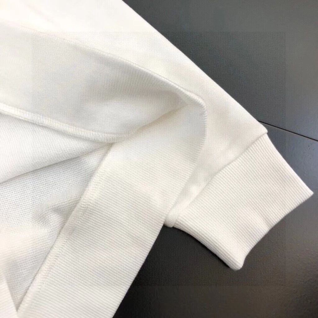 White sweatshirt sleeve with ribbed cuff and smooth knit texture
