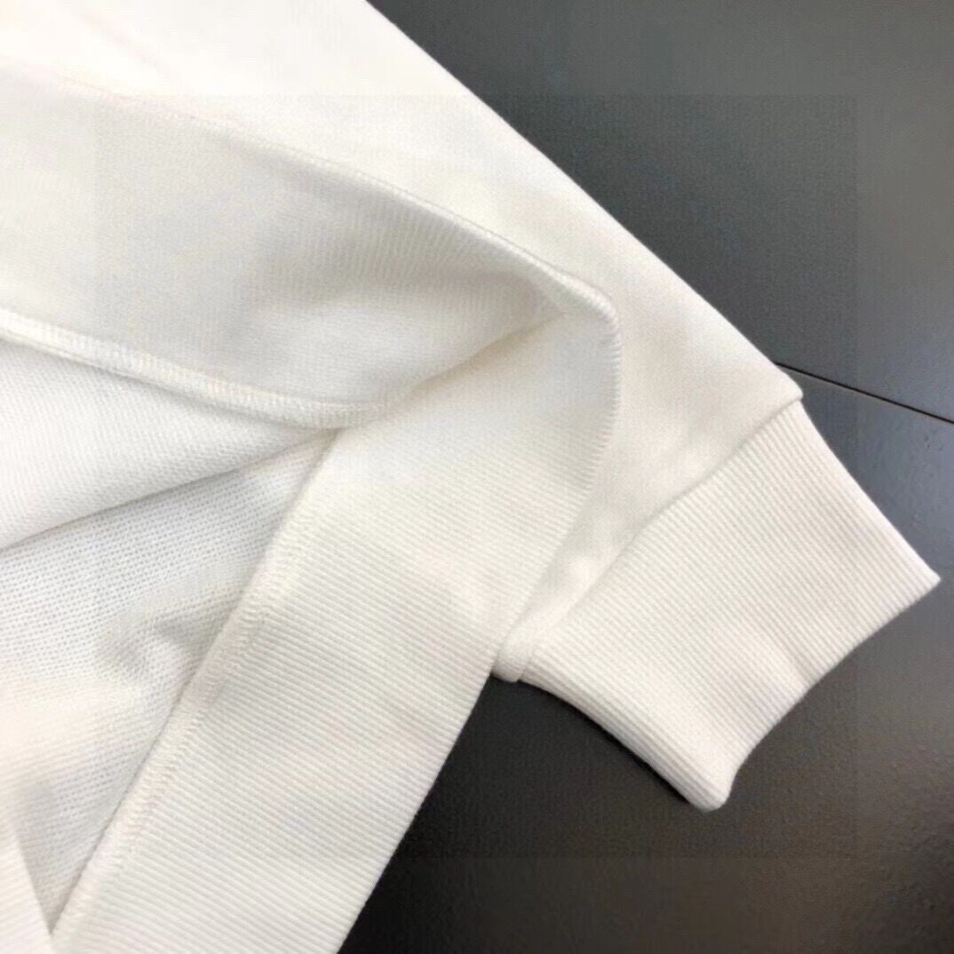 White sweatshirt sleeve with ribbed cuff and smooth knit texture