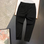 Black jogger pants with drawstring waist and ribbed hem cuffs