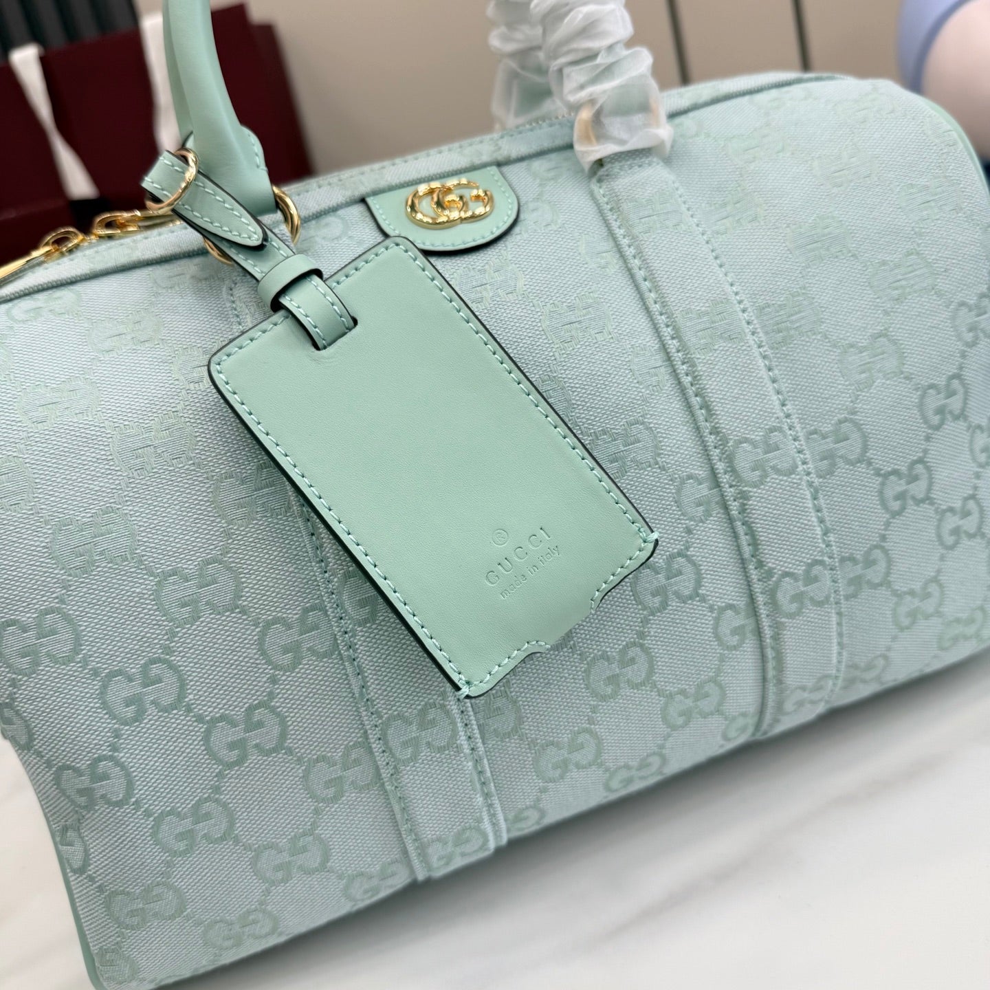 Gucci handbag in light blue with GG monogram, front card holder and gold clasp