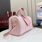 Gucci pale pink bag with G monogram print, side view, zip closure and crossbody strap