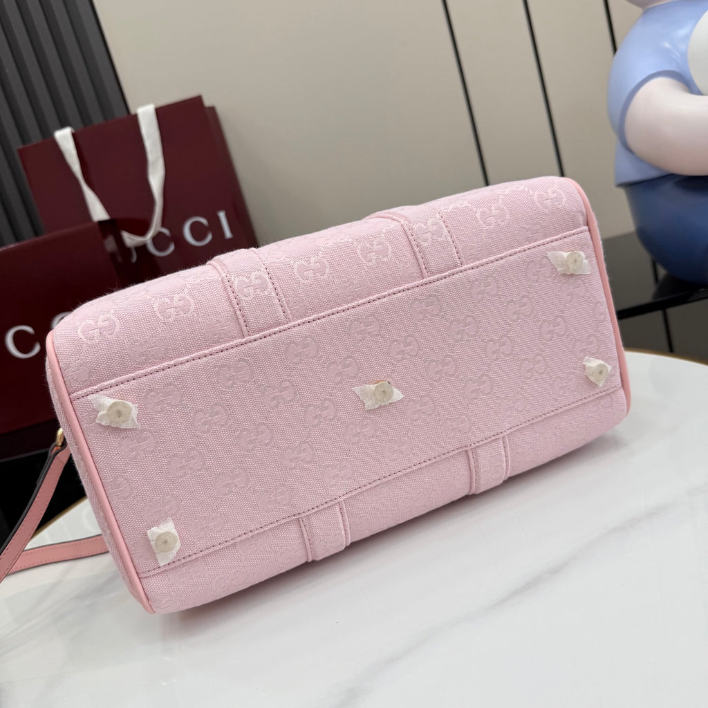 Gucci pale pink bag with G monogram print, back panel and heart stud accents