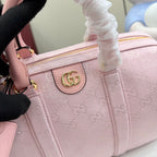 Gucci pale pink bag with G monogram print, gold-tone G emblem on front pocket