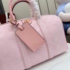 Pink Gucci GG canvas handbag with leather top handle and front logo pocket