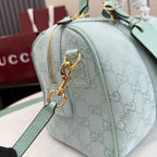 Gucci handbag in light blue with GG monogram, gold hardware and zipper pull
