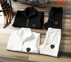 Black and white zip-up track jacket and jogger pants set pair