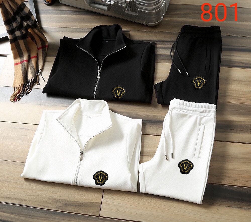 Black and white zip-up track jacket and jogger pants set pair