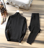 Black zip-up track jacket and jogger pants set, rear view