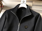 Black zip-up track jacket with metal zipper and small chest emblem