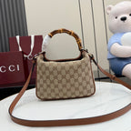 Gucci hobo bag with brown leather shoulder strap and tan GG monogram pattern