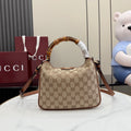 Gucci hobo bag in tan GG canvas with brown leather trim and top handle