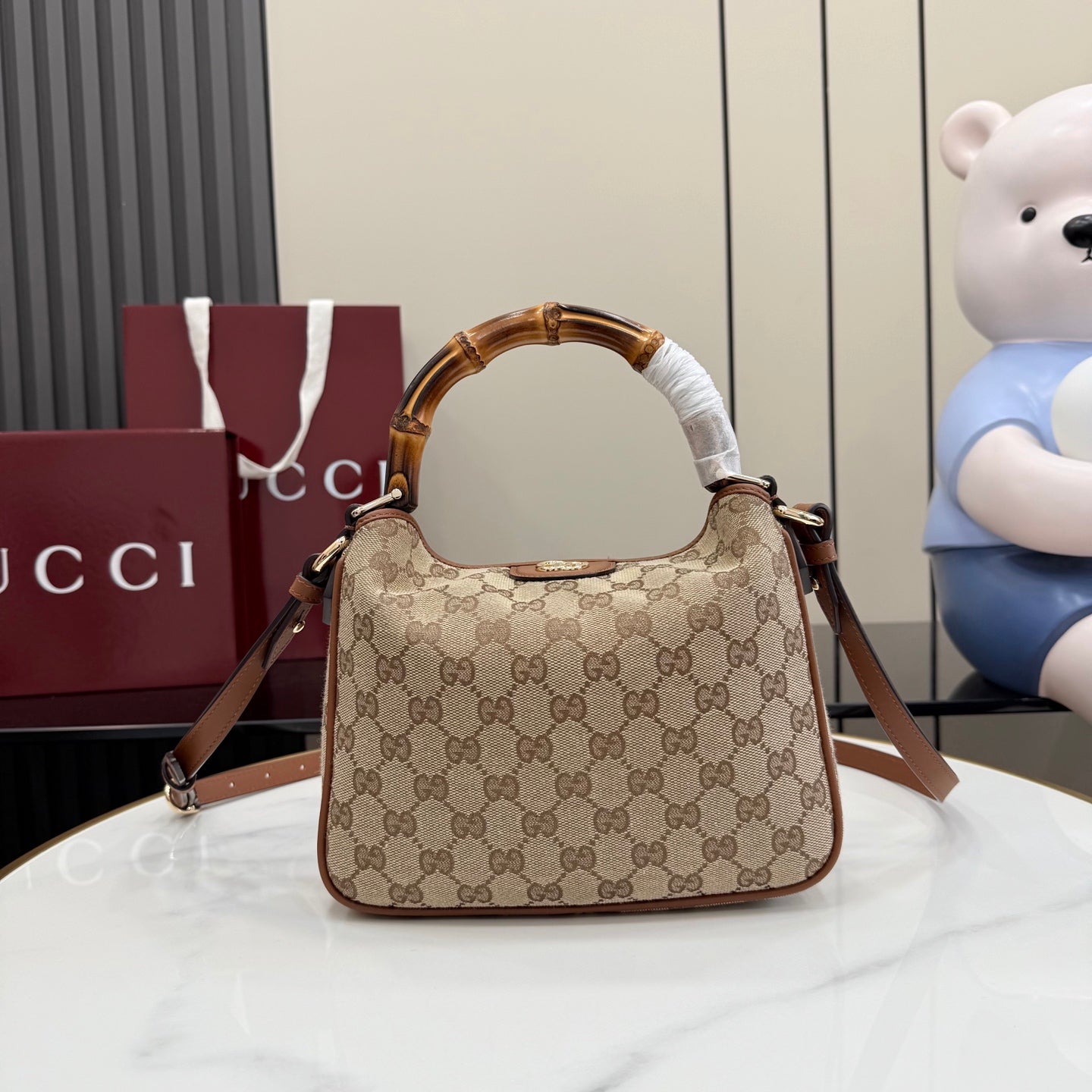 Gucci hobo bag in tan GG canvas with brown leather trim and top handle