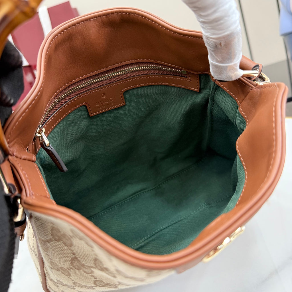Gucci hobo bag interior with green fabric lining and tan leather trim