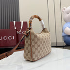 Gucci hobo bag with bamboo-style top handle, crossbody strap, and GG canvas body