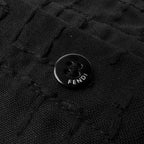 Fendi shirt button detail on dark black jacquard fabric with FENDI emboss