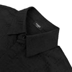 Fendi short-sleeve shirt placket close-up with FENDI label and dark jacquard fabric