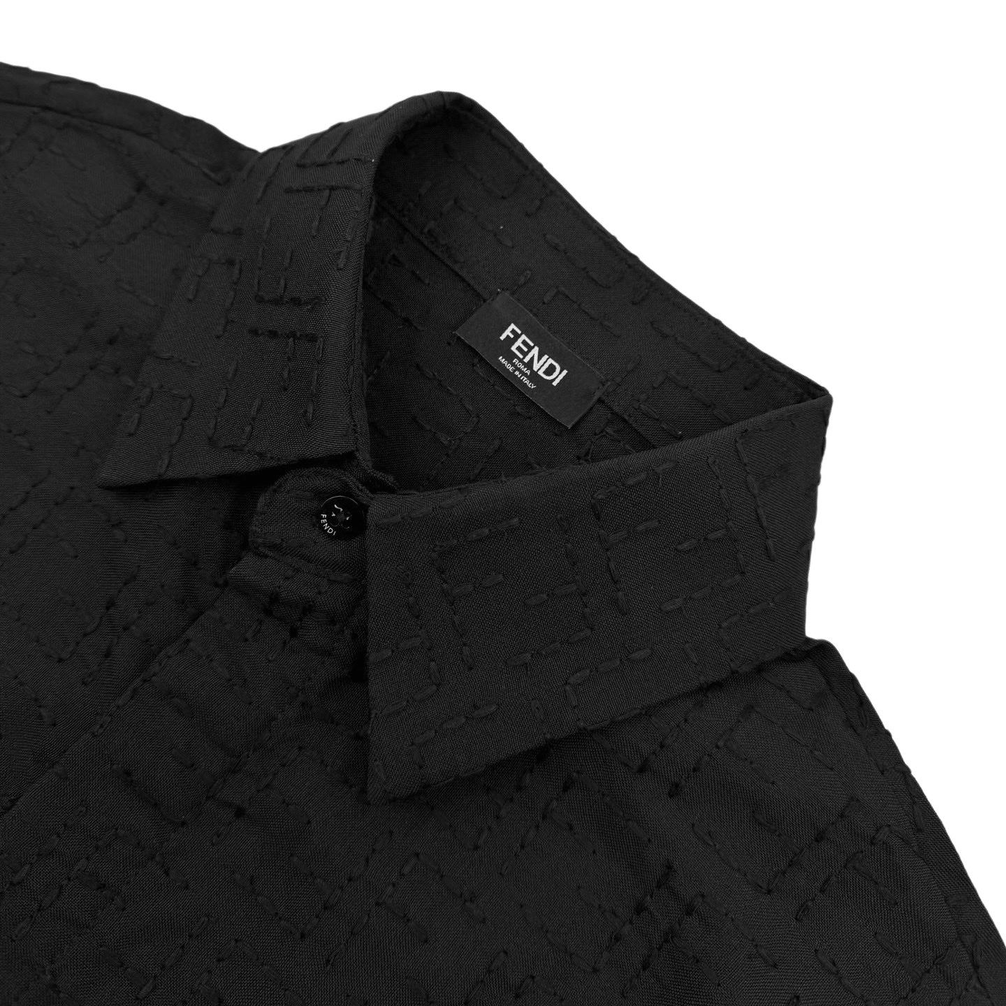 Fendi short-sleeve shirt placket close-up with FENDI label and dark jacquard fabric
