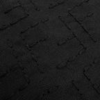Fendi shirt fabric close-up, dark black jacquard weave with logo-like pattern