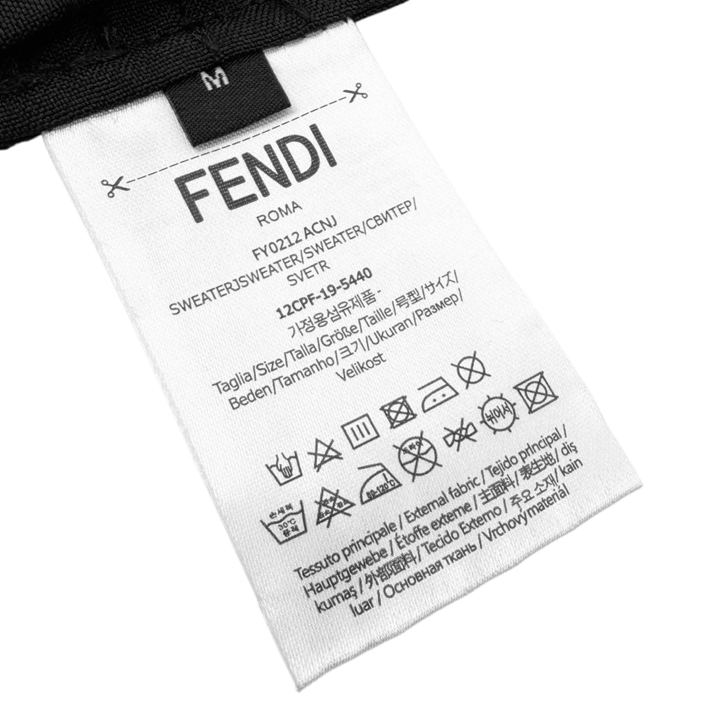 Fendi shirt care label tag with size and material information