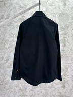 Black long-sleeve button-up shirt with back yoke and collar