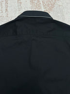 Black long-sleeve shirt back with collar yoke seam and smooth fabric