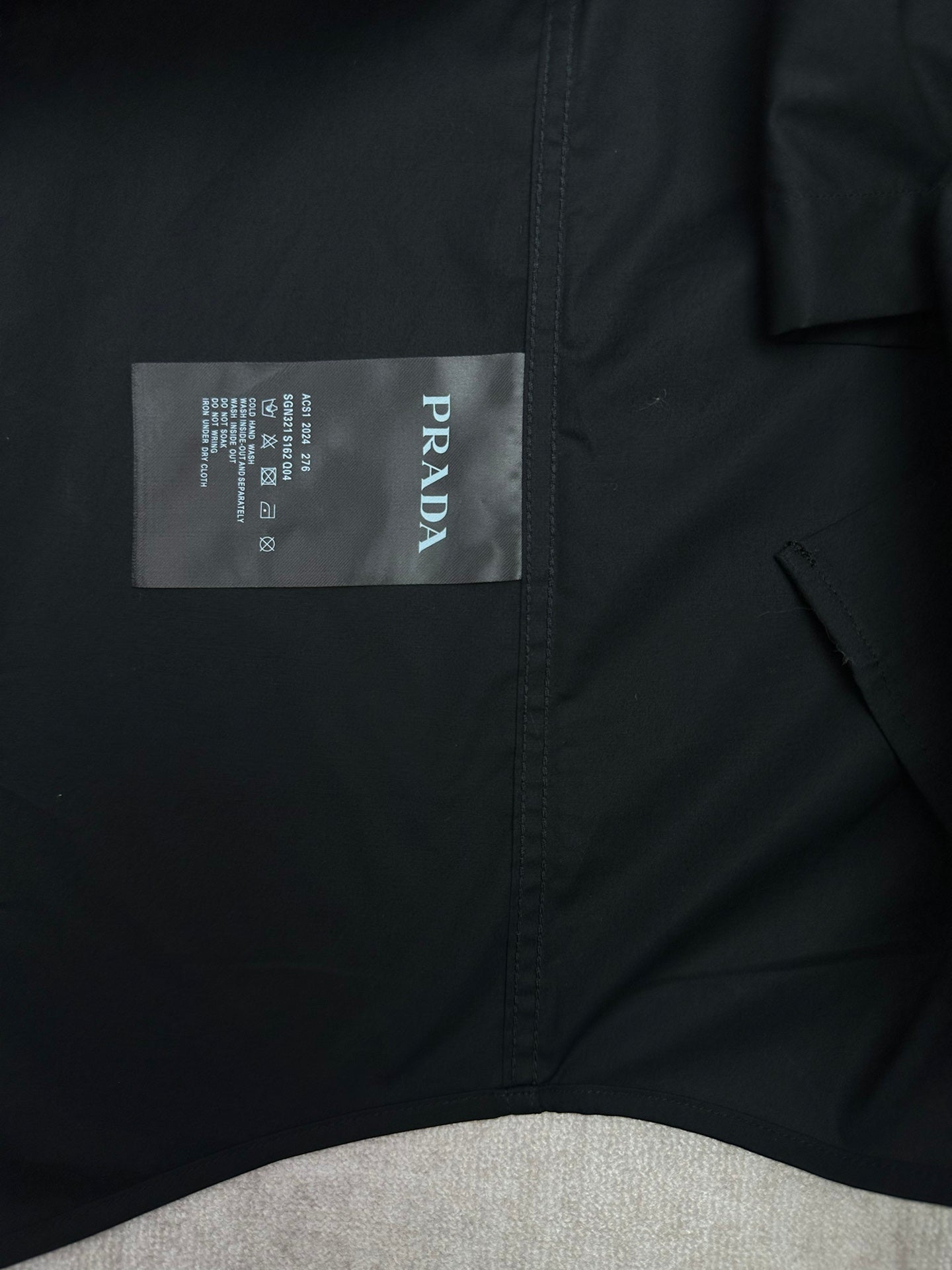 Long-sleeve button-up shirt with Prada neck size label on inside collar