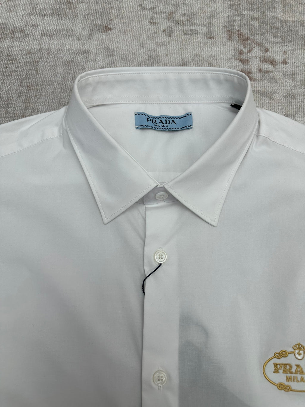 Prada long-sleeve button-up shirt, white, blue neck label and button front