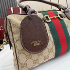 Designer barrel handbag with GG canvas, brown leather oval patch and green/red stripe