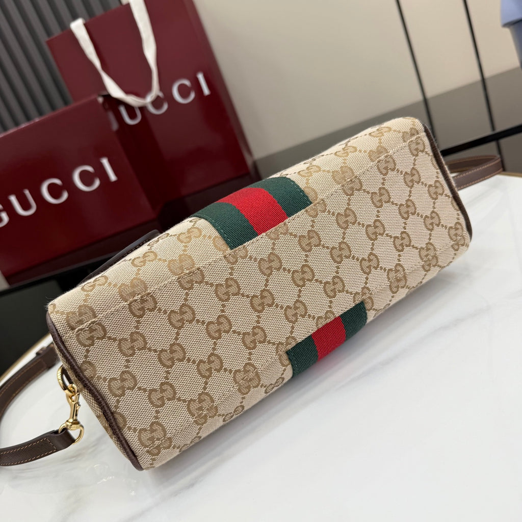 Gucci canvas long handbag with green-red web stripe, brown trim, and gold zipper detail