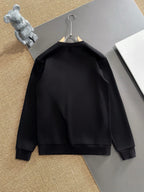 Black crewneck sweatshirt back view, plain with no visible print