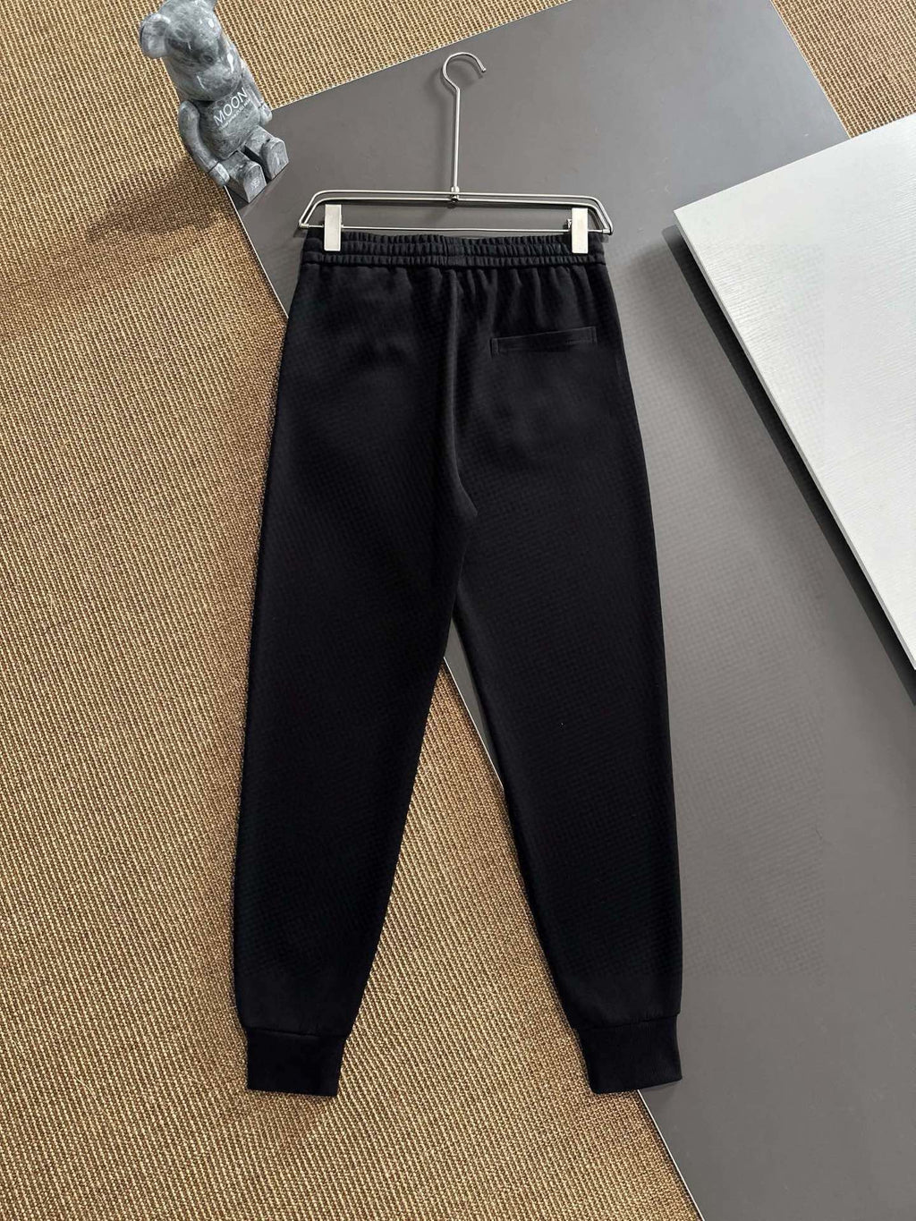 Black jogger pants back view with elastic waistband