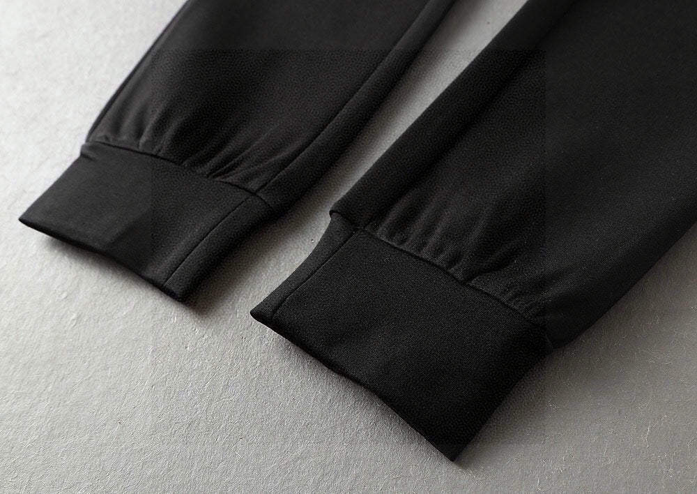 Black jogger pants folded cuff and leg hem detail