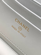 White leather label reading CHANEL and MADE IN ITALY on stitched trim