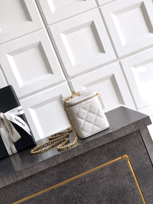 Quilted white leather crossbody bag with gold chain strap and small top handle