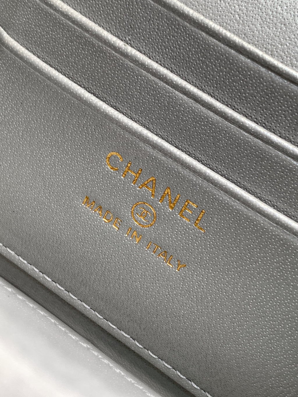 Chanel bag interior stamp reading CHANEL and Made in Italy.
