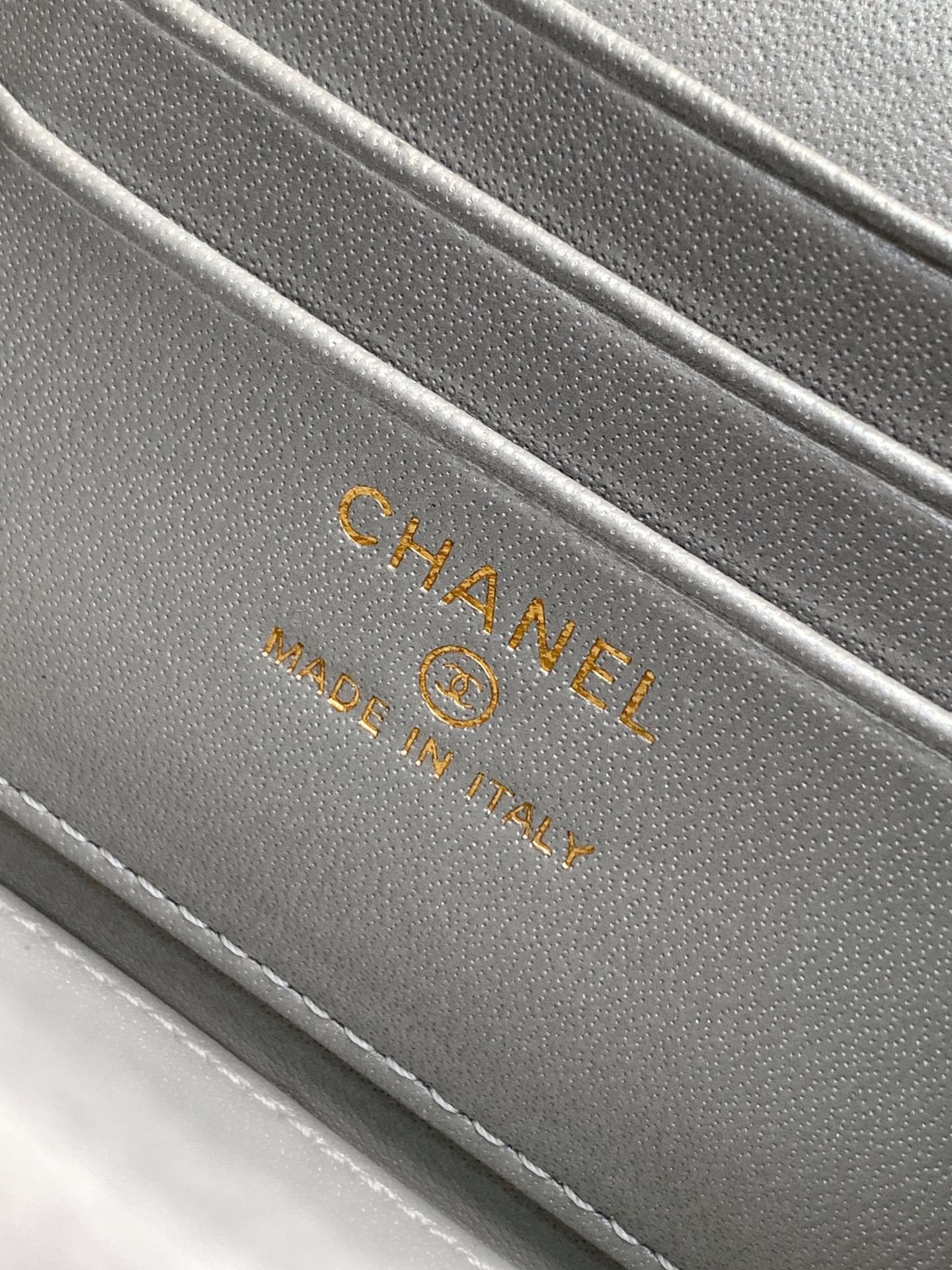 Chanel bag interior stamp reading CHANEL and Made in Italy.