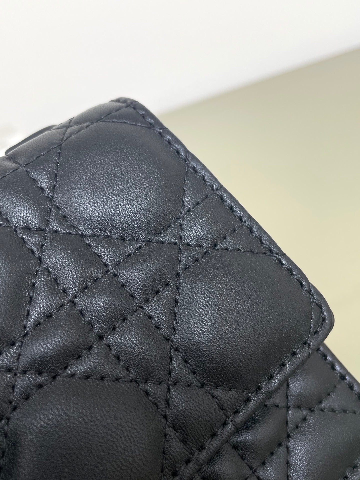 Dior quilted leather bag with diamond stitch pattern, dark navy