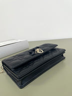 Dior quilted leather bag with bow clasp and chain strap, dark navy