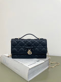 Dior quilted leather handbag with top handle, bow front, and flap closure, dark navy
