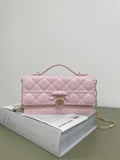 Pink quilted Dior handbag with top handle and gold chain strap